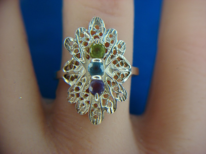 Sterling silver filigree ring with peridot, aqua, and amethyst gemstones