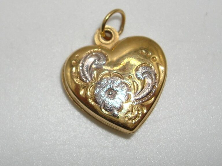 Vintage 375 sterling silver locket with gold overlay, swivel, and two compartments