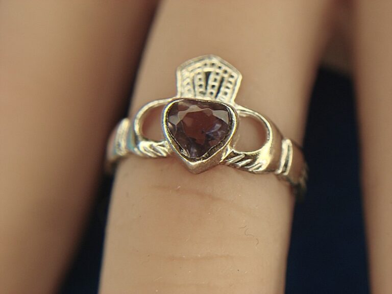 Sterling silver Claddagh ring with a purple heart-shaped stone, size 4 1/2