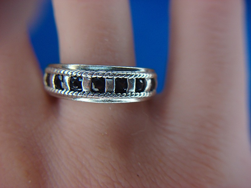 Sterling silver ring with seven round sapphires in a unique square setting, size 9