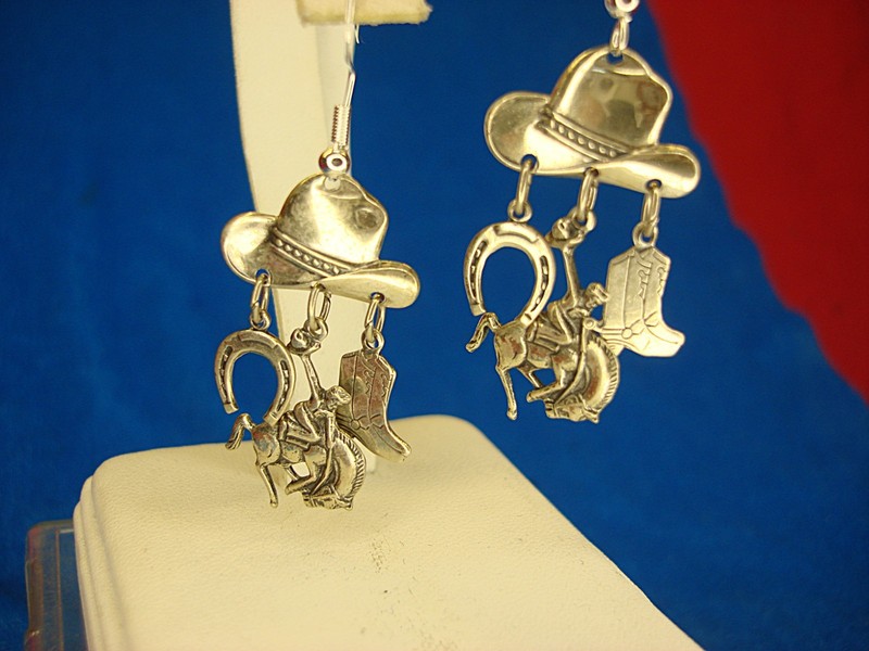 Sterling silver dangle earrings with cowboy hat, horseshoe, and bronco design