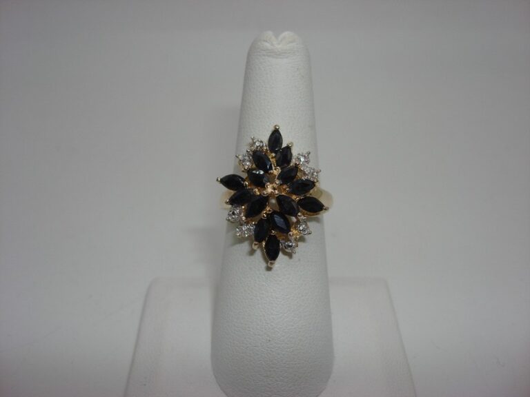 Sterling silver ring with blue topaz and diamond accents, size 6.5