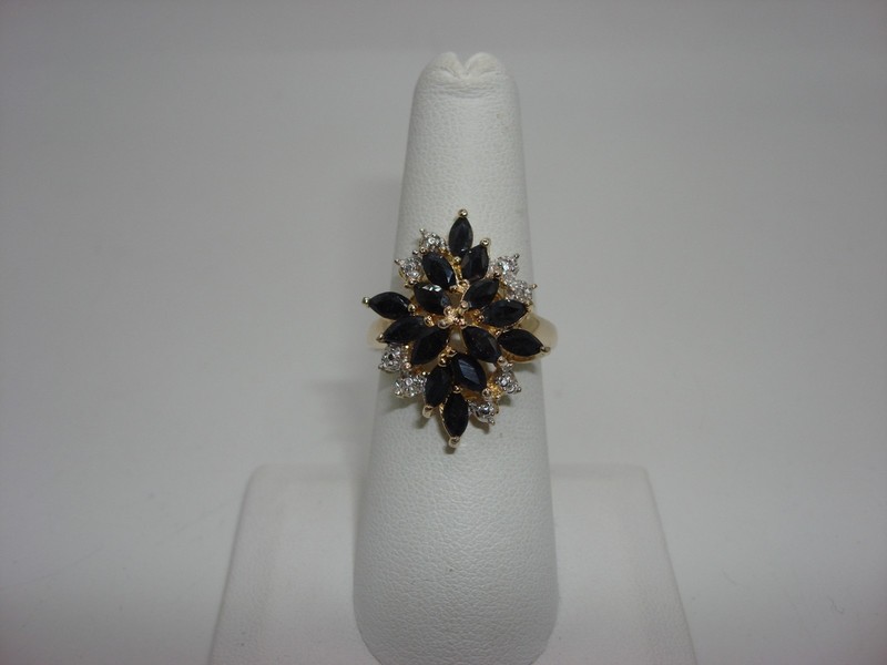 Sterling silver ring with blue topaz and diamond accents, size 6.5