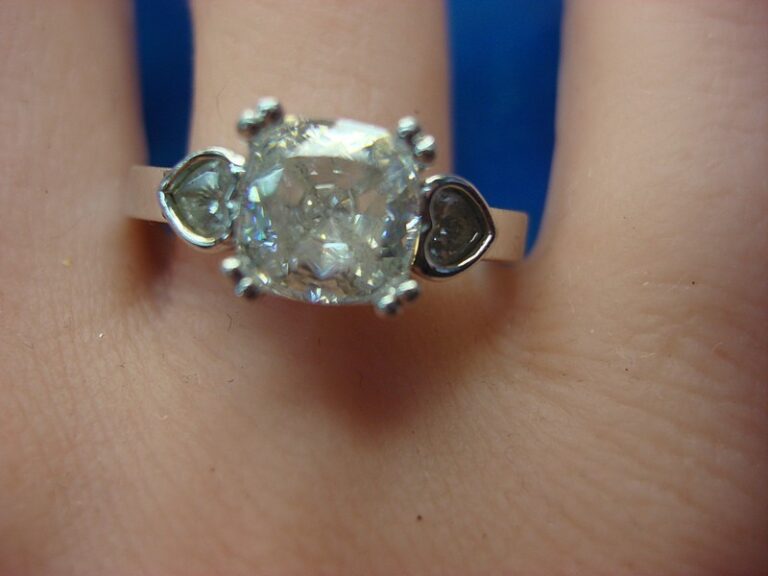 Sterling silver ring with square and heart shaped cubic zirconia stones, filigree setting, size 9