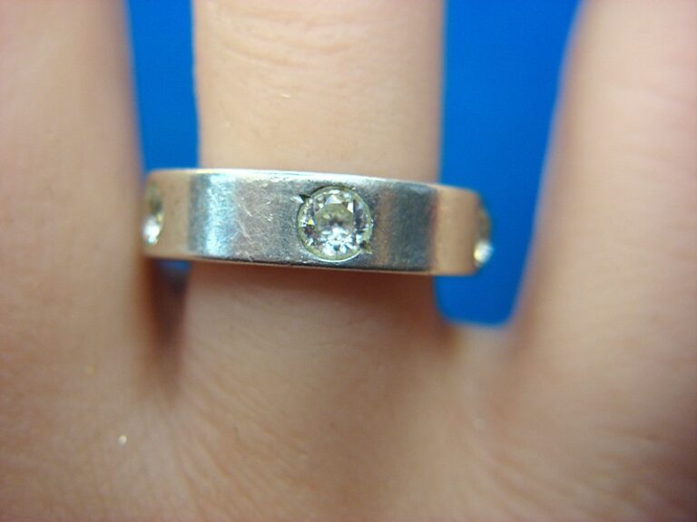 Sterling silver band ring with five simulated diamonds, size 6.5