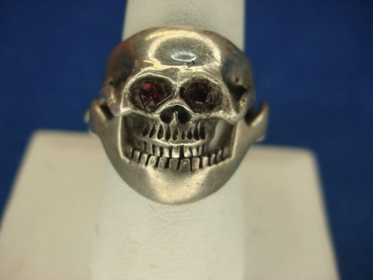 Vintage sterling silver skull ring with articulated jaw, red glass eyes, 1970s Mexican design, size 8