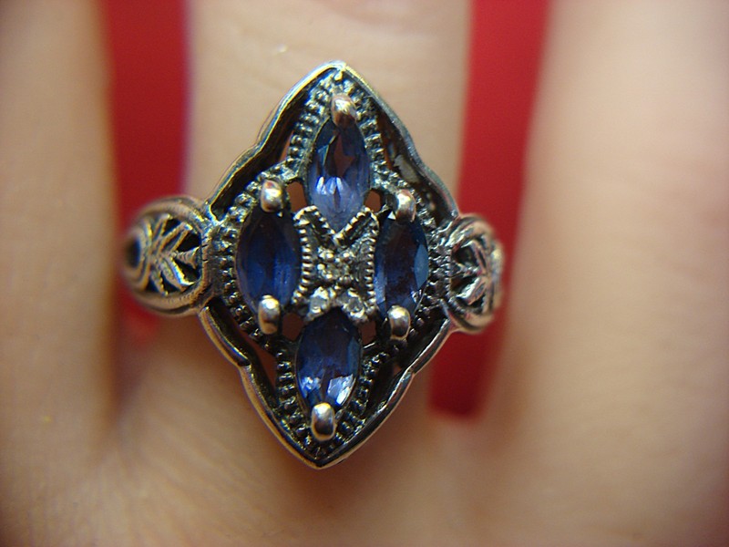 Sterling silver ring with blue stones and diamond accent, size 8