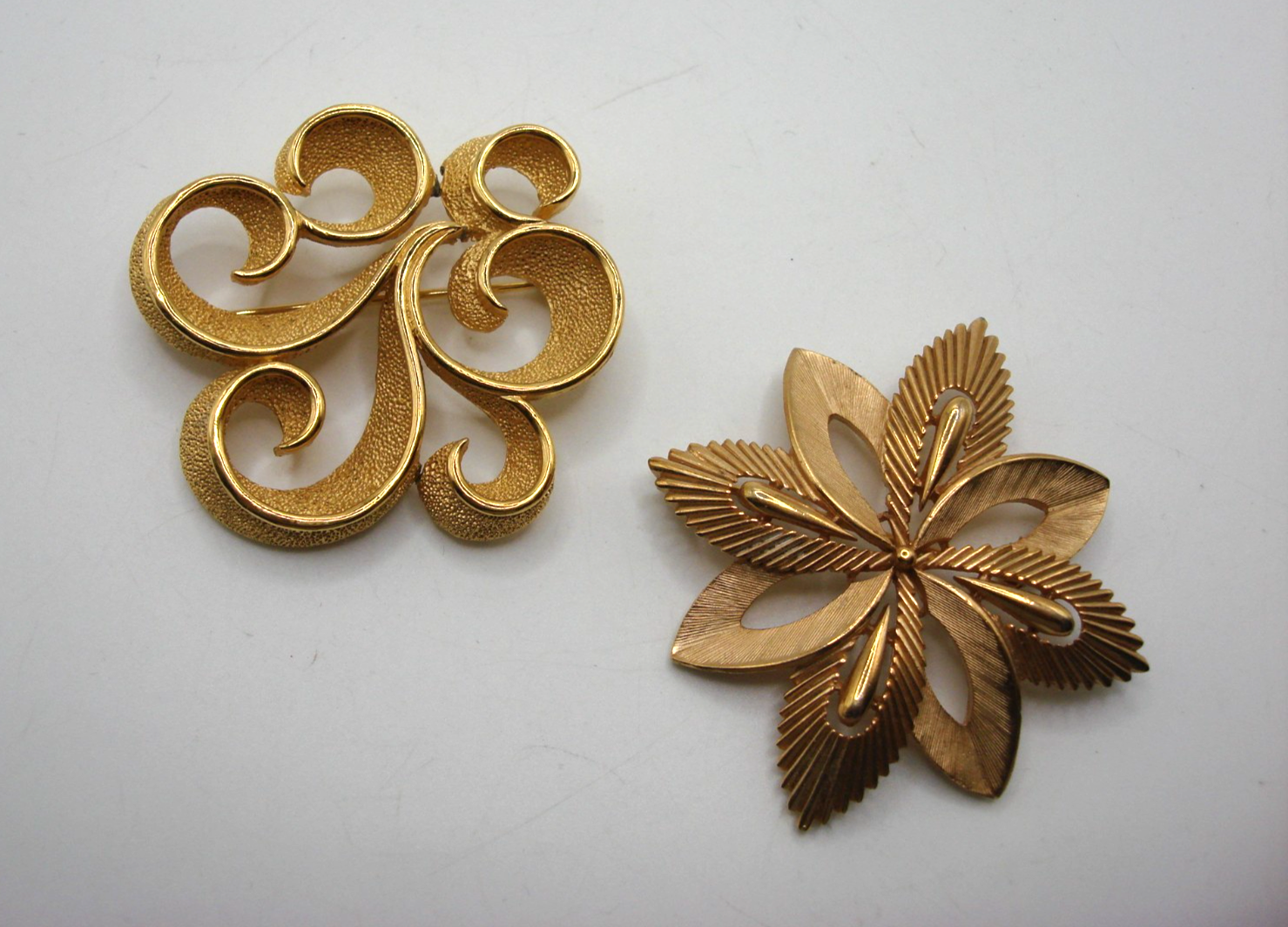 Pair of vintage Trifari gold tone crown pins in excellent condition