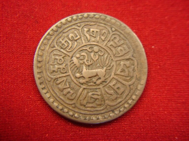 Antique Tibetan copper coin featuring a snow lion, minted between 1918 and 1928.