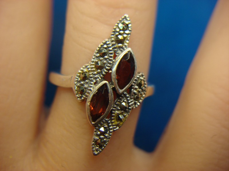 Sterling silver ring with red marquise stones and marcasite halo