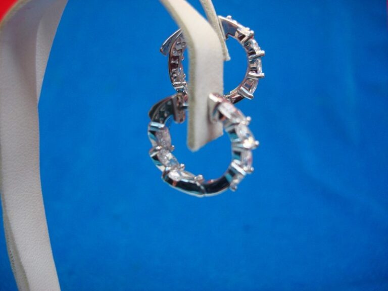 Sterling silver hinged hoop earrings with cubic zirconia stones