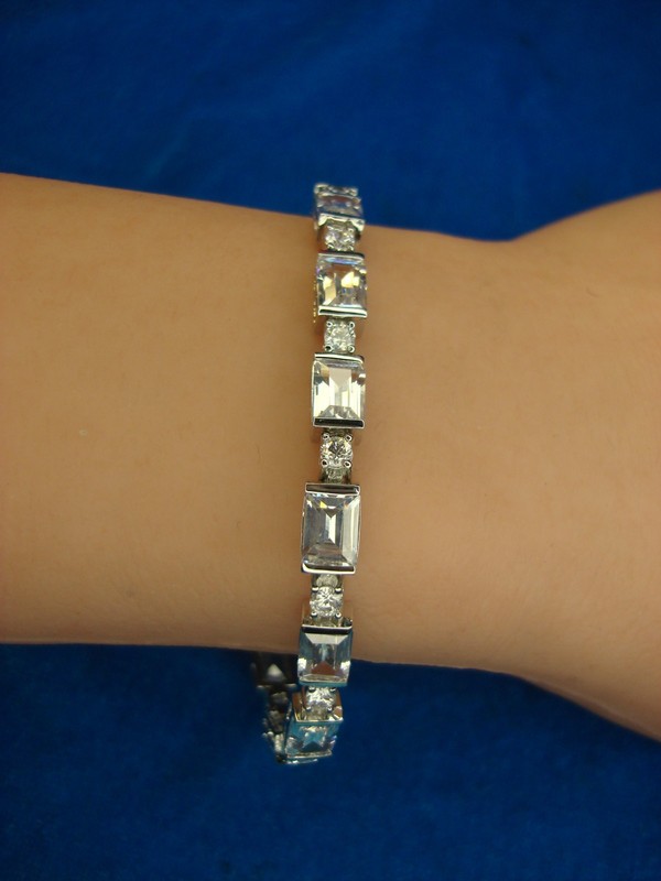 Flashing silver bracelet with sparkling rectangular and round stones, 7 1/4 inches