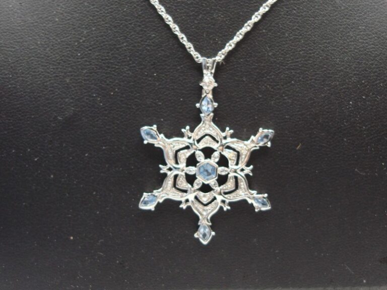 Sterling silver snowflake pendant necklace with blue and clear cubic zirconia stones