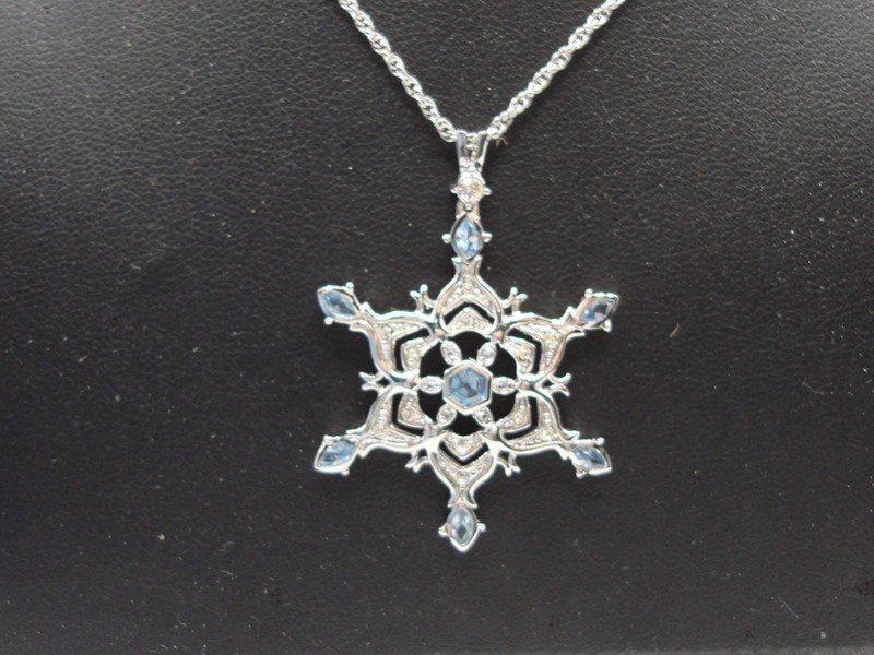 Sterling silver snowflake pendant necklace with blue and clear cubic zirconia stones
