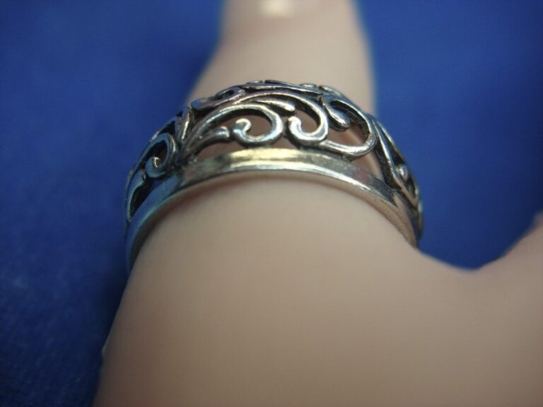 Sterling silver ring with unique fancy pattern and diamond accents, size 8