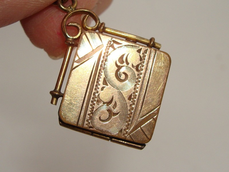 Antique Victorian rose gold filled S&B Co. locket fob, engraved and signed, with picture compartments.