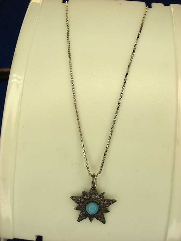 Vintage sterling silver starburst pendant with turquoise gemstone and 18-inch chain