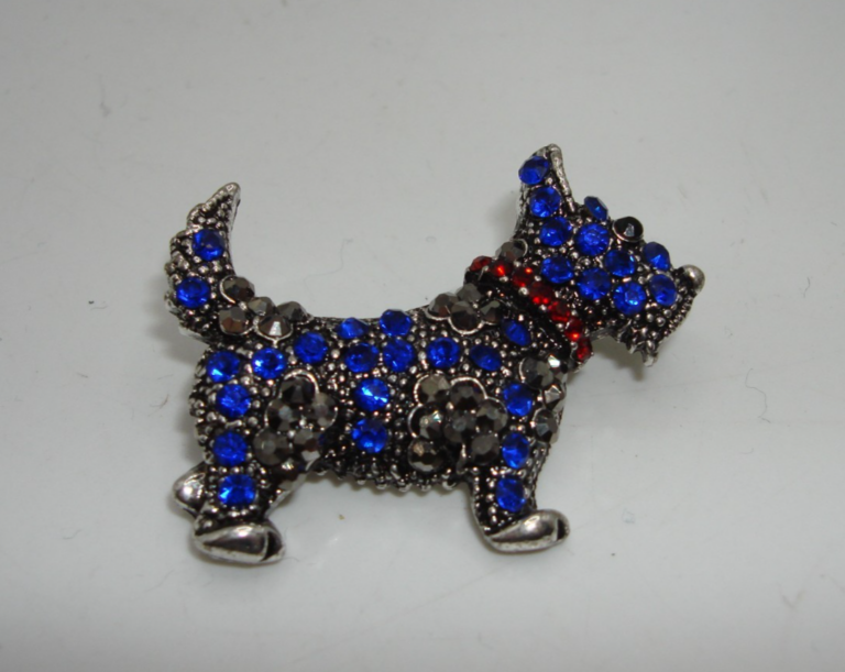 Vintage rhinestone Scottie dog pin with blue rhinestones, marcasite accents, and a red rhinestone collar.