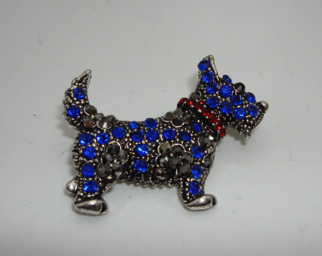Vintage rhinestone Scottie dog pin with blue rhinestones, marcasite accents, and a red rhinestone collar.
