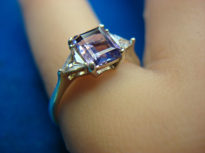 Sterling silver ring with an emerald-cut amethyst and simulated diamonds, size 10 1/4