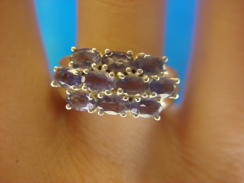 Sterling silver ring with ten oval simulated amethyst stones, size 6